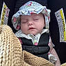 baby, blanket, car_seat, child, child_seat, closeup, cozy, cute, face, hat, headwear, indoor, infant, knit, peaceful, portrait, resting, safety_harness, sleeping, young_child