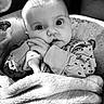 Feya is registered to the contest to win money with this photo: baby, black_and_white, blanket, child, closeup, clothing, curious, cute, expression, face, hands, indoor, infant, newborn, pacifier, person, portrait, sleepwear, soft_texture, young