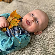 Mason joined the competition — help win amazing prizes! baby, child, autumn, leaves, smile, happy, blanket, outdoor, fall, nature, closeup, cute, infant, skin, clothing, playful, holding, portrait, young, relaxing