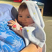 Sage joined the competition — help win amazing prizes! baby, blanket, child, cute, face, hand, holding, person, portrait, smile, strawberry, sleeve, night, parking_lot, shirt, blue, light, store_sign, outdoor, adult