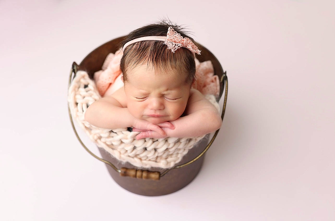 Charlee joined the competition — help win amazing prizes! baby, baby_products, baby_toddler_clothing, basket, bathing, cheek, child, comfort, eyelash, fashion_accessory, hair_accessory, happy, head, headpiece, jewellery, metal, pattern, person, plant, sweetness