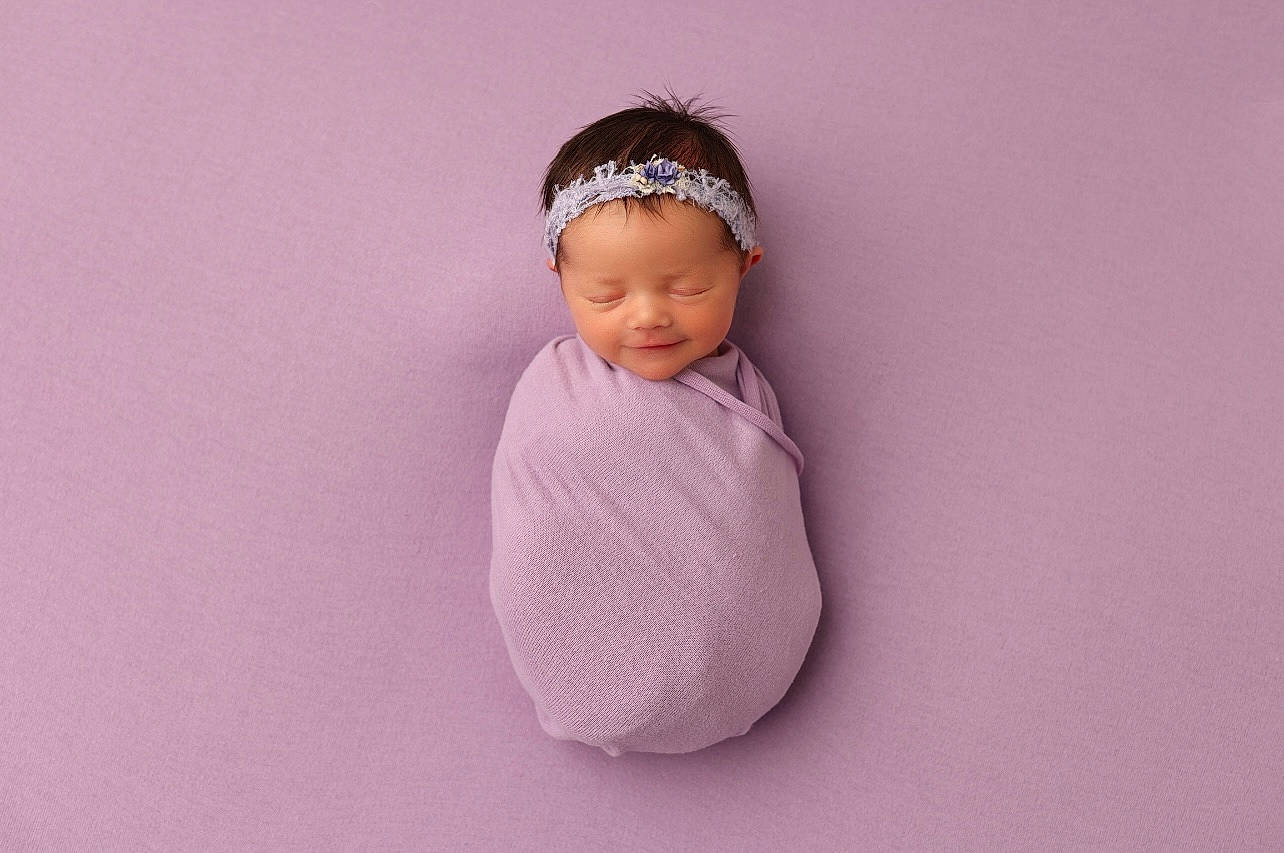 Charlee is registered to the contest to win money with this photo: baby, baby_toddler_clothing, cap, cheek, eye, eyebrow, face, fashion_accessory, flash_photography, flooring, fun, hair_accessory, head, headband, headgear, headwear, human_body, magenta, neck, person