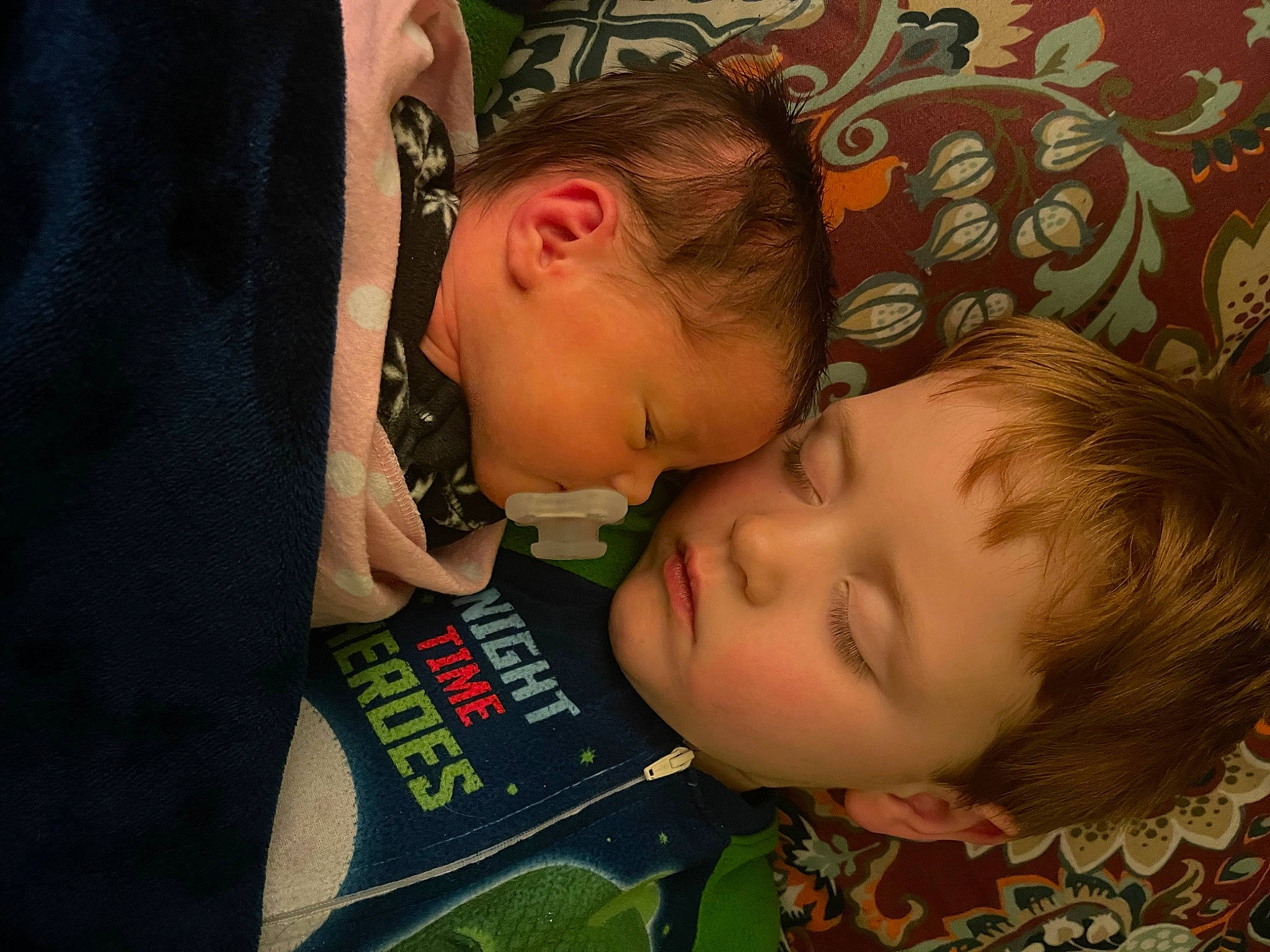 Kenton is registered to the contest to win money with this photo: baby, baby_products, baby_toddler_clothing, bedtime, cheek, child, comfort, ear, eyelash, fun, happy, head, iris, linens, nose, pattern, person, room, skin, t_shirt