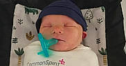 Skylar joined the competition — help win amazing prizes! newborn, baby, sleeping, infant, bassinet, pacifier, swaddle, blanket, hat, navy_blue, portrait, indoors, nursery, name_sign, skylar, plaid, pillow, cozy, peaceful, photography