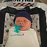 newborn, baby, sleeping, infant, bassinet, pacifier, swaddle, blanket, hat, navy_blue, portrait, indoors, nursery, name_sign, skylar, plaid, pillow, cozy, peaceful, photography