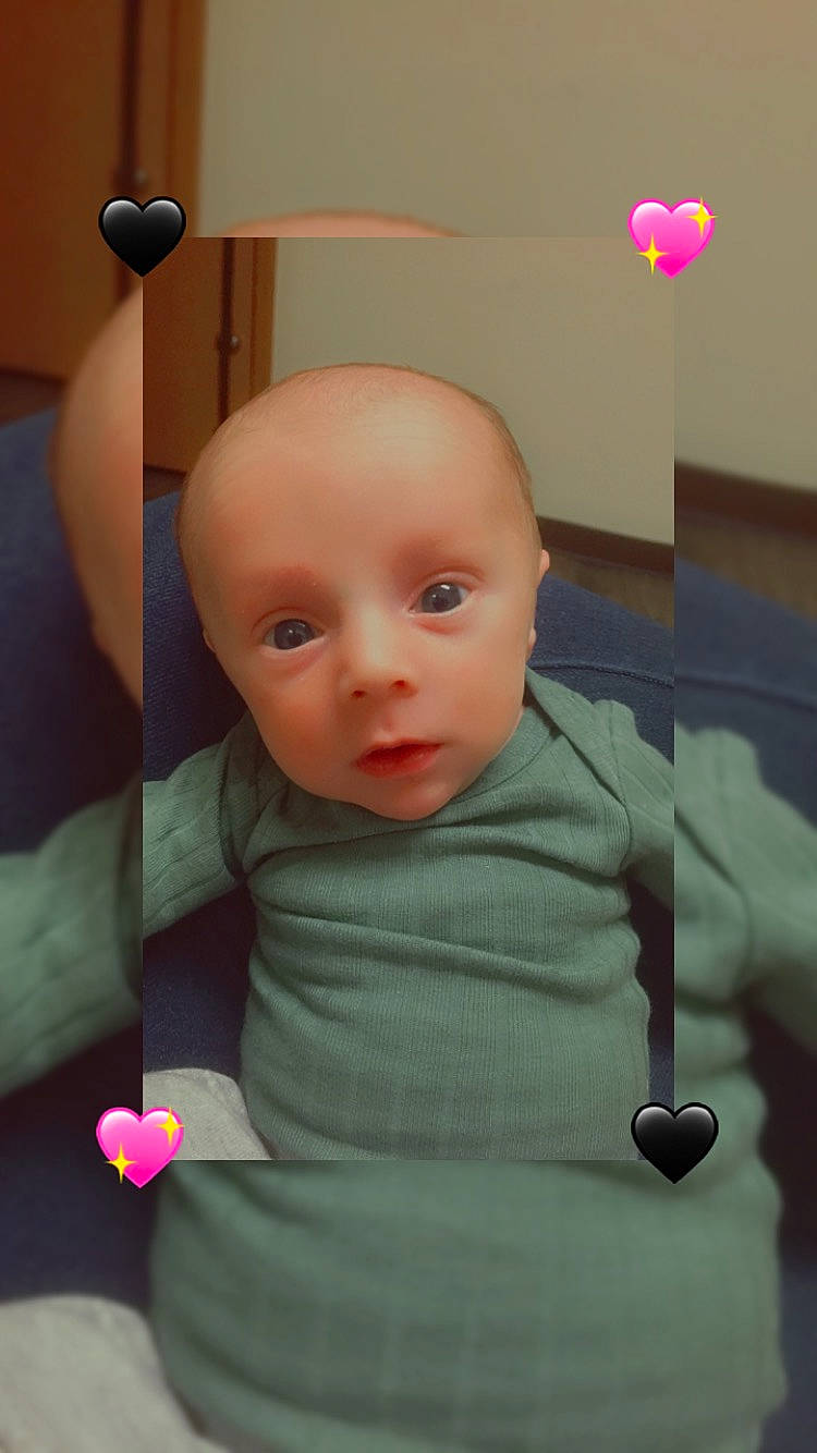 Luka joined the competition — help win amazing prizes! baby, baby_products, baby_toddler_clothing, balloon, cheek, child, comfort, flooring, hairstyle, light_fixture, lighting, linens, person, petal, pink, room, sitting, skin, t_shirt, toddler