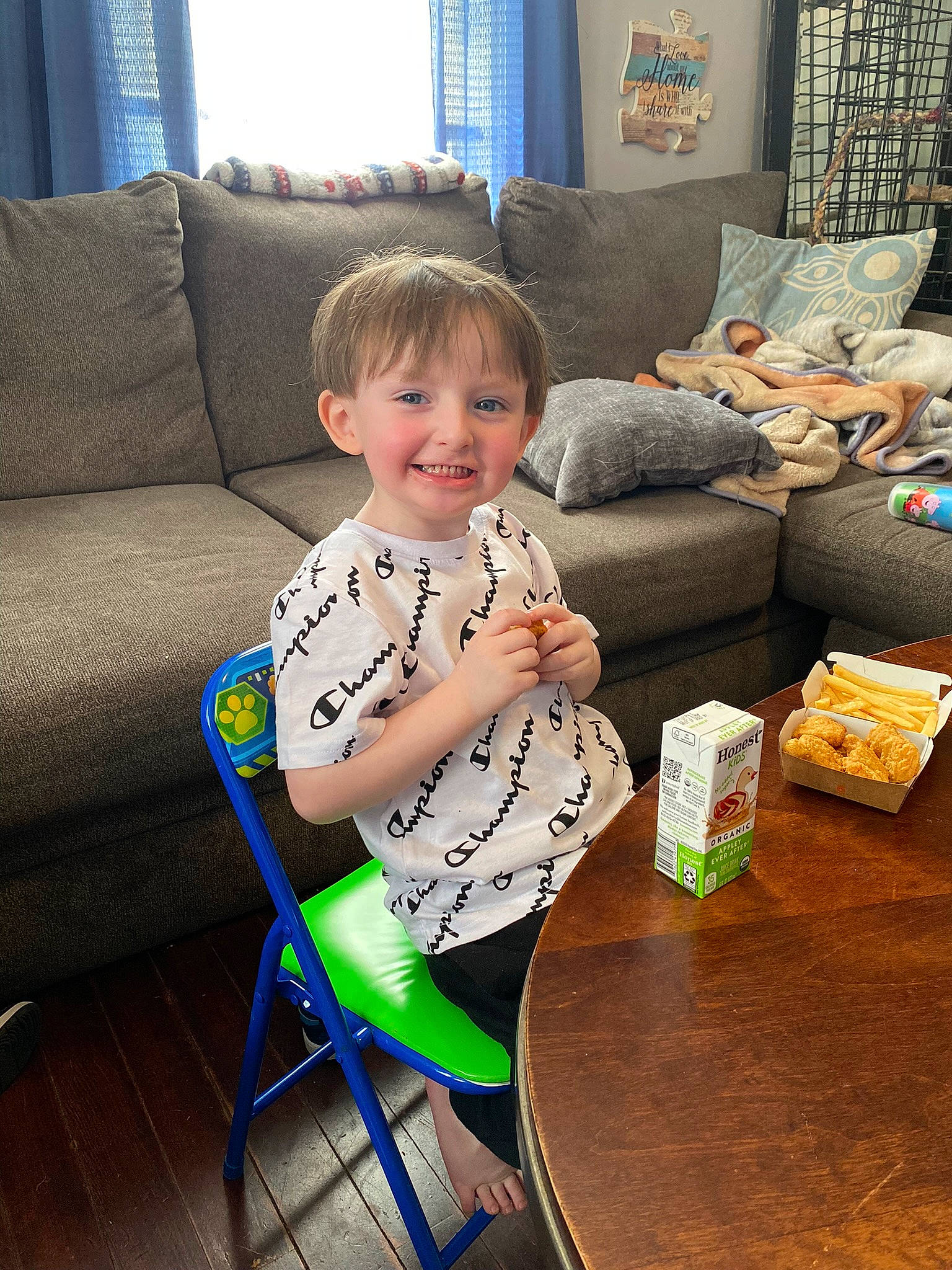 Christian joined the competition — help win amazing prizes! baby_toddler_clothing, child, comfort, couch, curtain, furniture, holiday, interior_design, joy, lamp, living_room, person, picture_frame, pillow, room, sitting, sleeve, smile, studio_couch, table