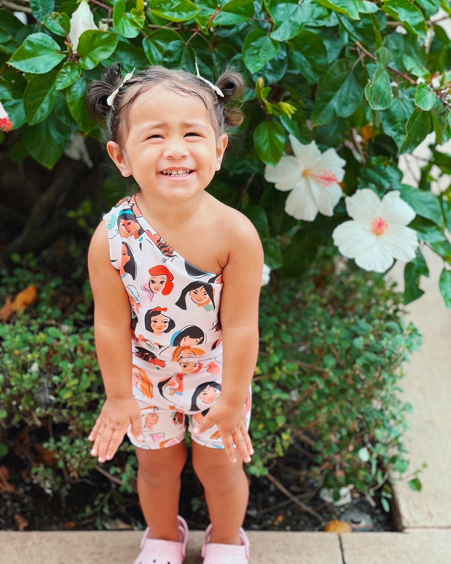 Kylea joined the competition — help win amazing prizes! arm, baby_toddler_clothing, botany, dress, face, flower, green, happy, head, joy, leaf, neck, people_in_nature, person, petal, pink, plant, shorts, shoulder, skin