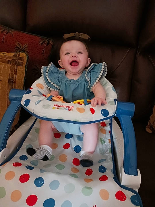 Saylor joined the competition — help win amazing prizes! baby, baby_carriage, baby_products, baby_safety, baby_toddler_clothing, chair, child, comfort, event, fun, leisure, pattern, person, pink, product, recreation, sitting, sleeve, smile, toddler