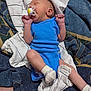 Gary is registered to the contest to win money with this photo: baby, newborn, sleeping, pacifier, blue_onesie, white_socks, blanket, fabric, infant, cute, small_hands, small_feet, resting, indoors, soft_texture, comfort, child, peaceful, portrait, lying_down