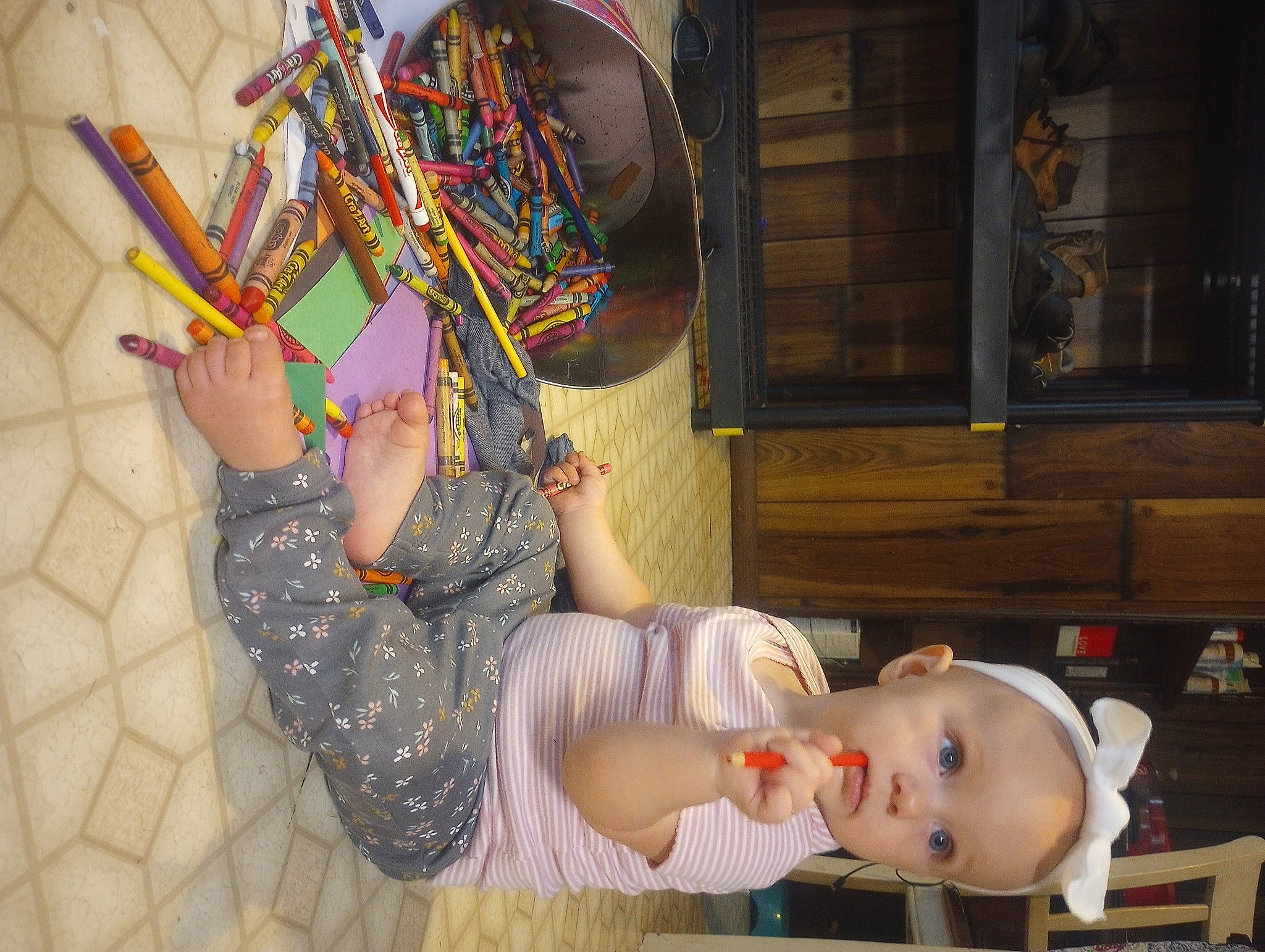 Olivia is registered to the contest to win money with this photo: baby, baby_toddler_clothing, basket, cabinetry, child, clothing, fashion_accessory, foot, fun, happy, hat, human_leg, pattern, person, room, sandal, sitting, toddler, visual_arts