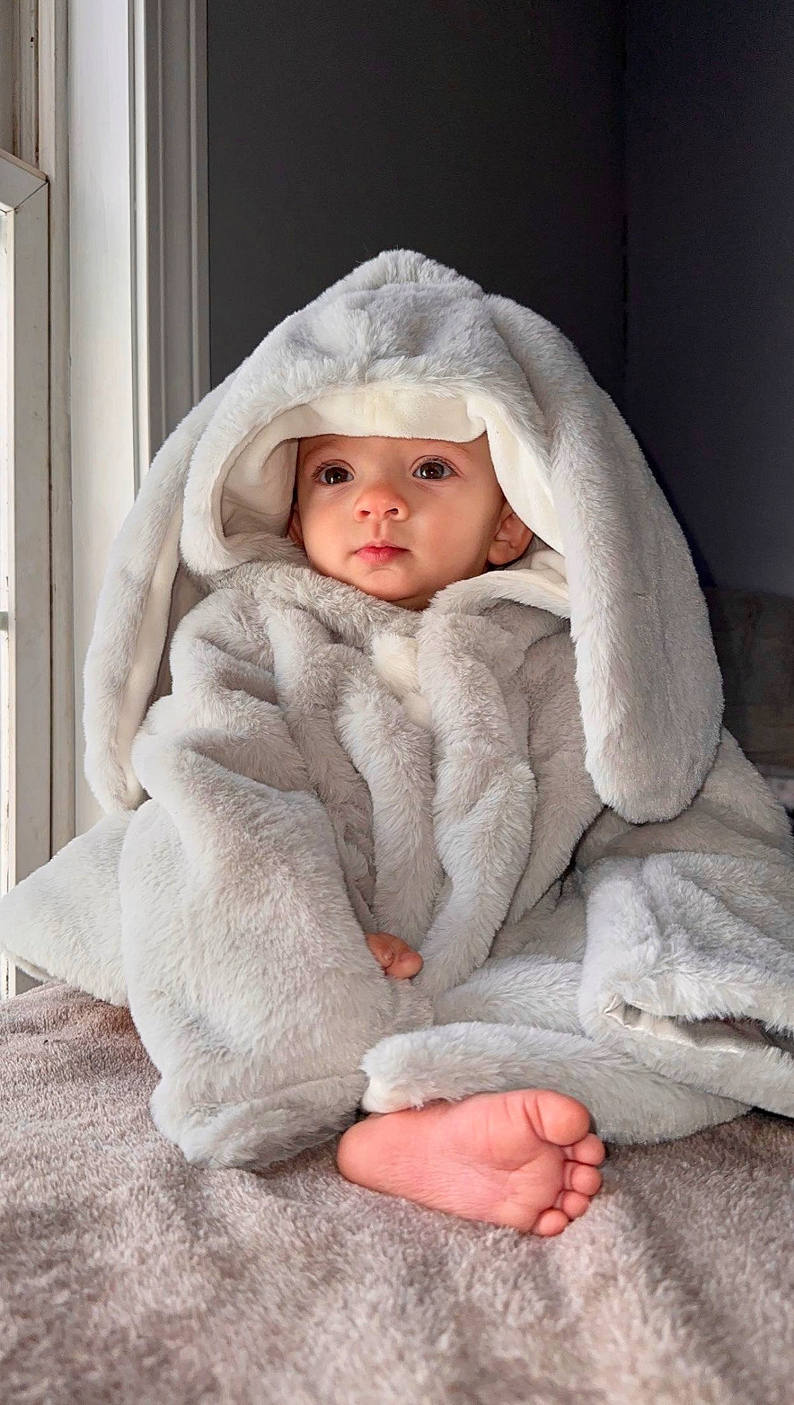 Adalynne is registered to the contest to win money with this photo: baby, baby_toddler_clothing, cheek, child, collar, comfort, eye, flash_photography, flooring, fur, headwear, hood, linens, lip, outerwear, person, portrait_photography, sitting, sleeve, stock_photography