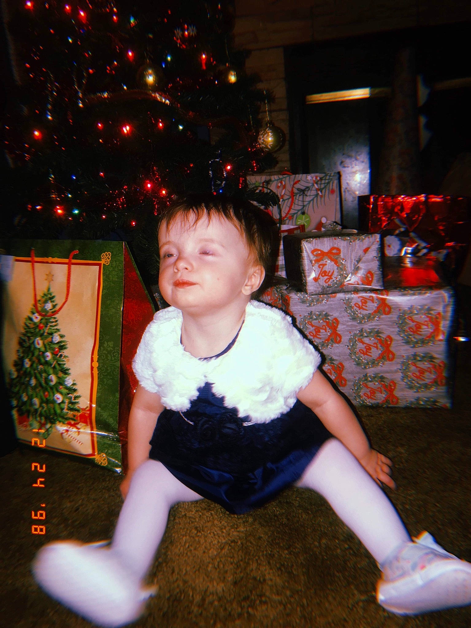 Bella Adams is registered to the contest to win money with this photo: child, christmas, christmas_eve, christmas_tree, fun, holiday, person, smile, toddler, tree