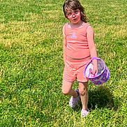 Bella Rose is registered to the contest to win money with this photo: child, girl, grass, outdoor, sunny, pink_clothing, shorts, tank_top, purple_shoes, bucket, nature, greenery, casual, summer, portrait, young, playful, standing, field, daylight