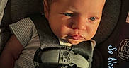 Gunner is registered to the contest to win money with this photo: baby, baby_boy, blanket, blue_blanket, car_seat, child, closeup, clothing, cute, expression, face, indoors, infant, newborn, peaceful, portrait, safety_harness, sitting, straps, sunlight