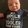 Gunner joined the competition — help win amazing prizes! baby, infant, child, onesie, clothing, text, black, face, portrait, sitting, cute, expression, cheeks, skin, eyes, person, indoor, soft_light, message, humor