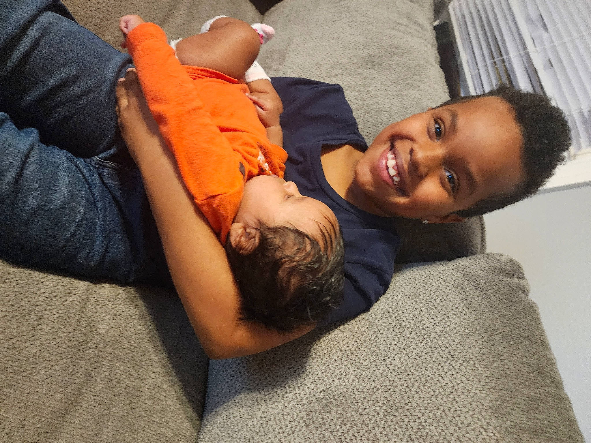 Isaac joined the competition — help win amazing prizes! abdomen, arm, child, comfort, couch, elbow, flash_photography, flooring, fun, hand, happy, human_body, human_leg, joint, joy, knee, leg, person, sitting, skin