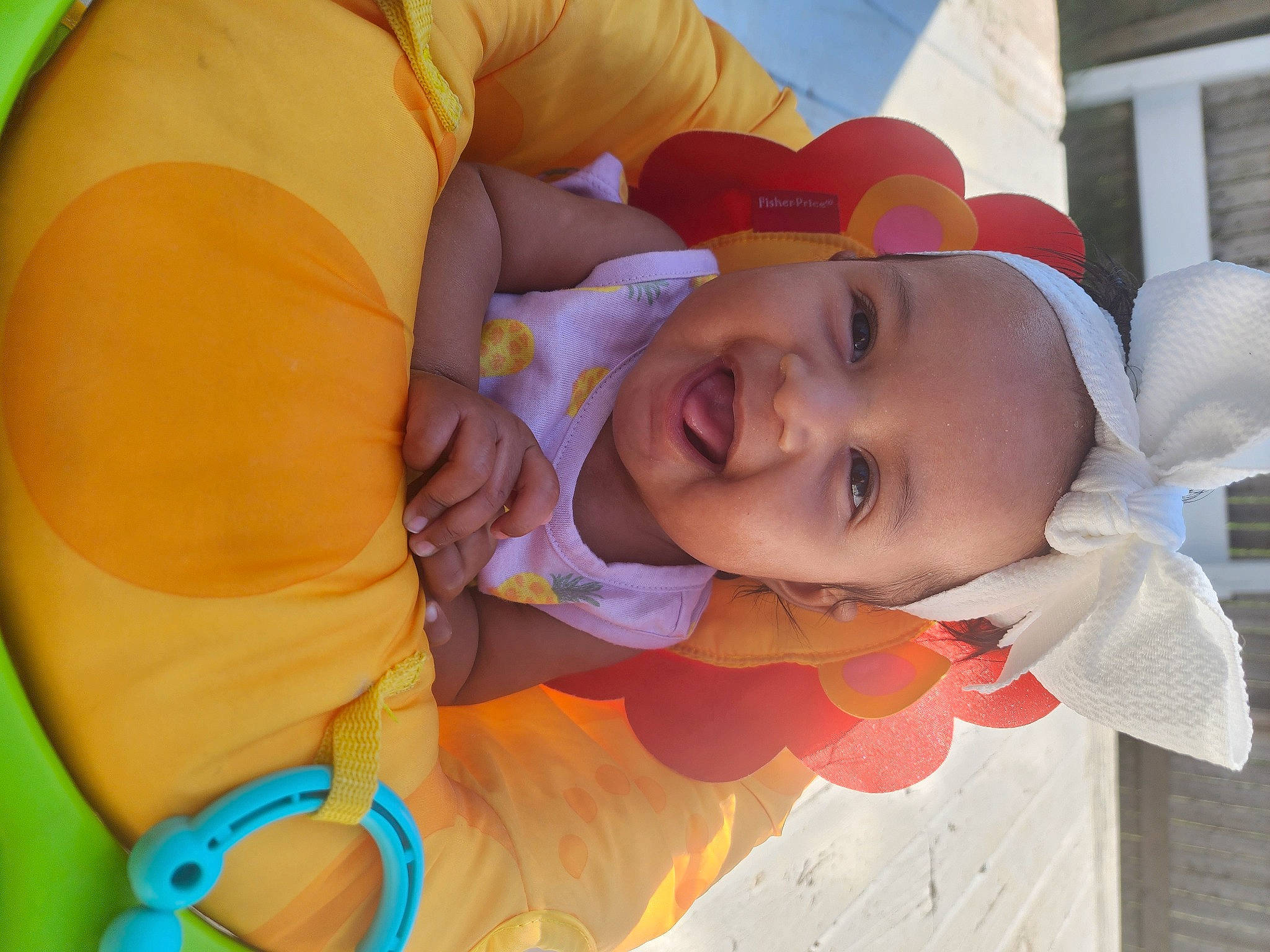 Neliah is registered to the contest to win money with this photo: baby, baby_products, baby_toddler_clothing, cheek, child, finger, fun, happy, hat, leisure, mouth, nose, orange, person, product, skin, smile, toddler, white, window