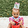 Mariposa is registered to the contest to win money with this photo: baby, child, pink_clothing, crown, watermelon_cake, fruit, blueberries, strawberries, kiwi, melon, outdoor, blanket, grass, celebration, half_birthday, cute, sitting, portrait, summer, food