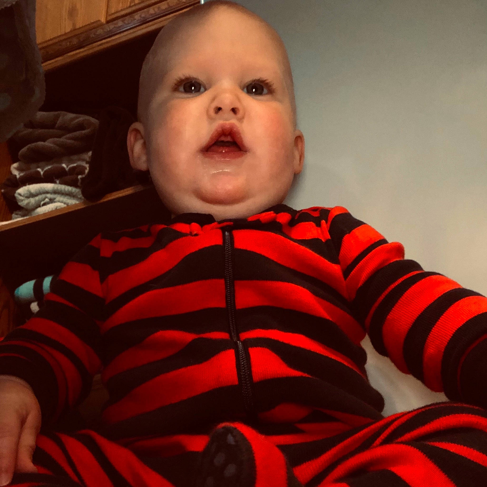 Brecken joined the competition — help win amazing prizes! baby_toddler_clothing, cheek, chin, comfort, eye, eyebrow, finger, forehead, hair, happy, iris, lip, mouth, neck, nose, orange, outerwear, person, skin, sleeve