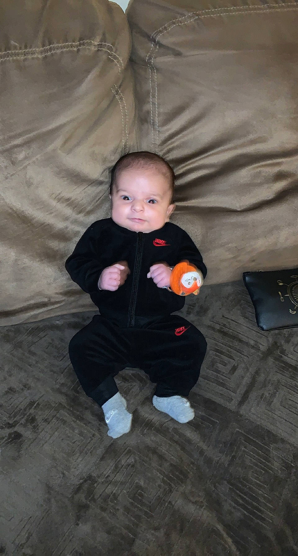 Tyson joined the competition — help win amazing prizes! baby, baby_toddler_clothing, child, comfort, darkness, eye, floor, flooring, fun, grass, hardwood, linens, person, room, sitting, smile, sock, t_shirt, telephone, toddler