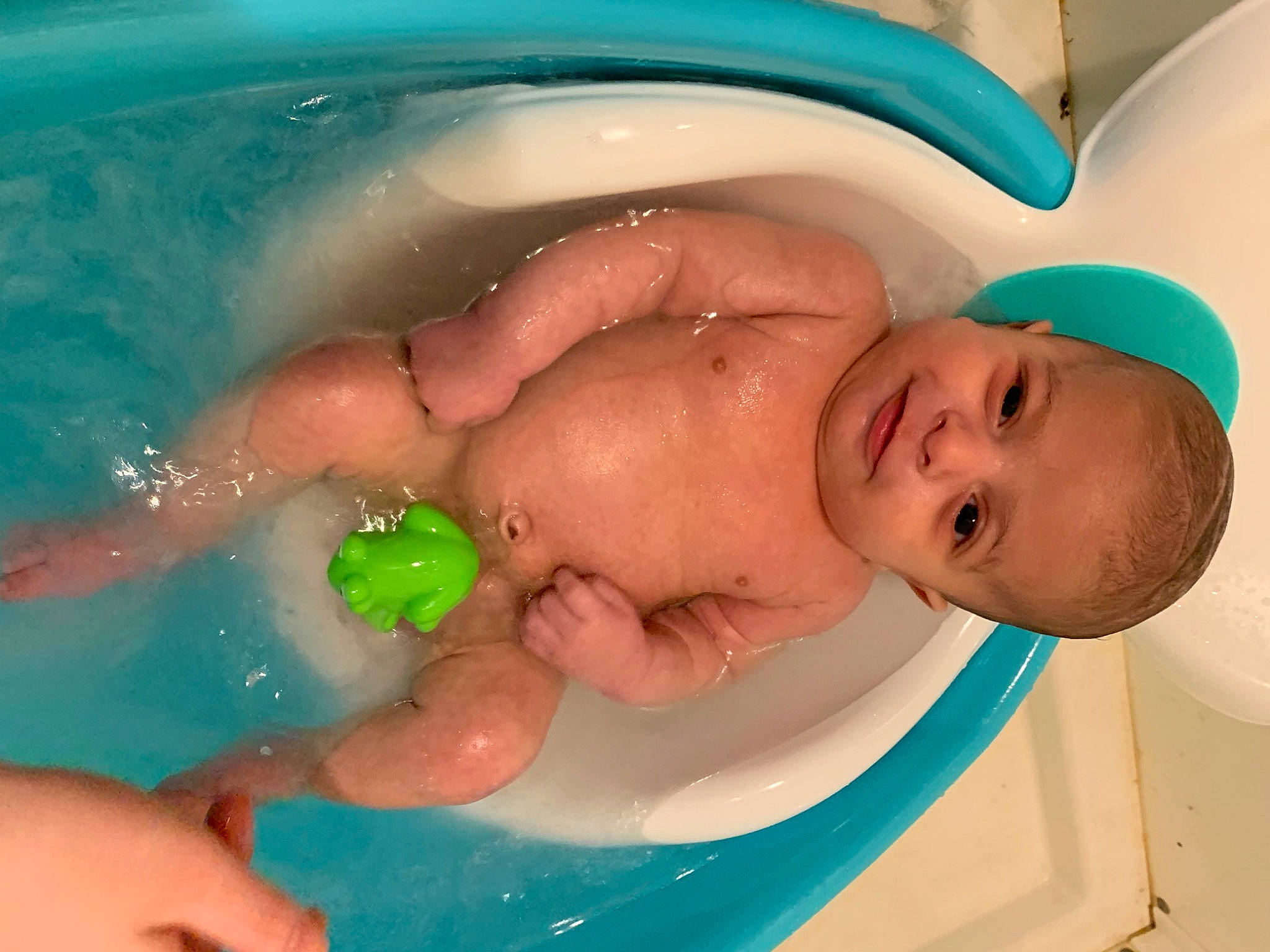 Tyson is registered to the contest to win money with this photo: baby, baby_bathing, bath_toy, bathing, bathroom, bathtub, comfort, ear, finger, fluid, fun, hand, happy, leisure, liquid, person, plumbing_fixture, product, skin, toddler