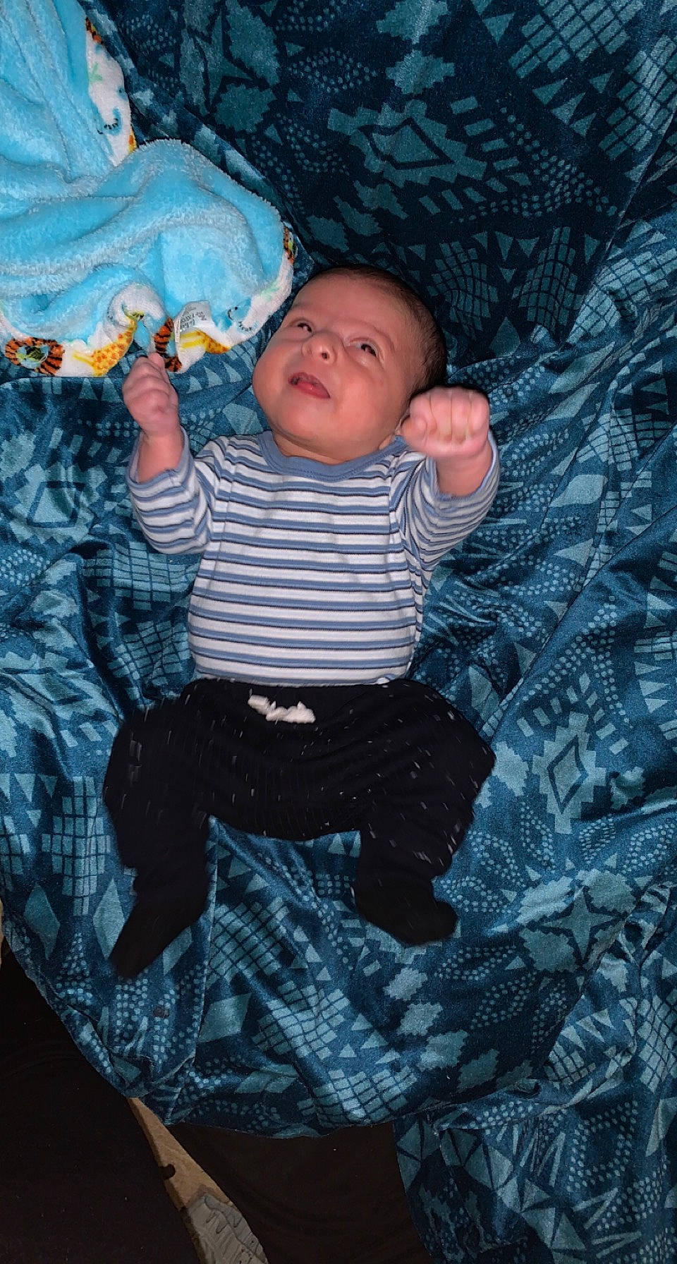 Ty is registered to the contest to win money with this photo: baby, baby_toddler_clothing, child, comfort, eye, flash_photography, fun, linens, pattern, person, sitting, sleeve, t_shirt, textile, toddler, tree