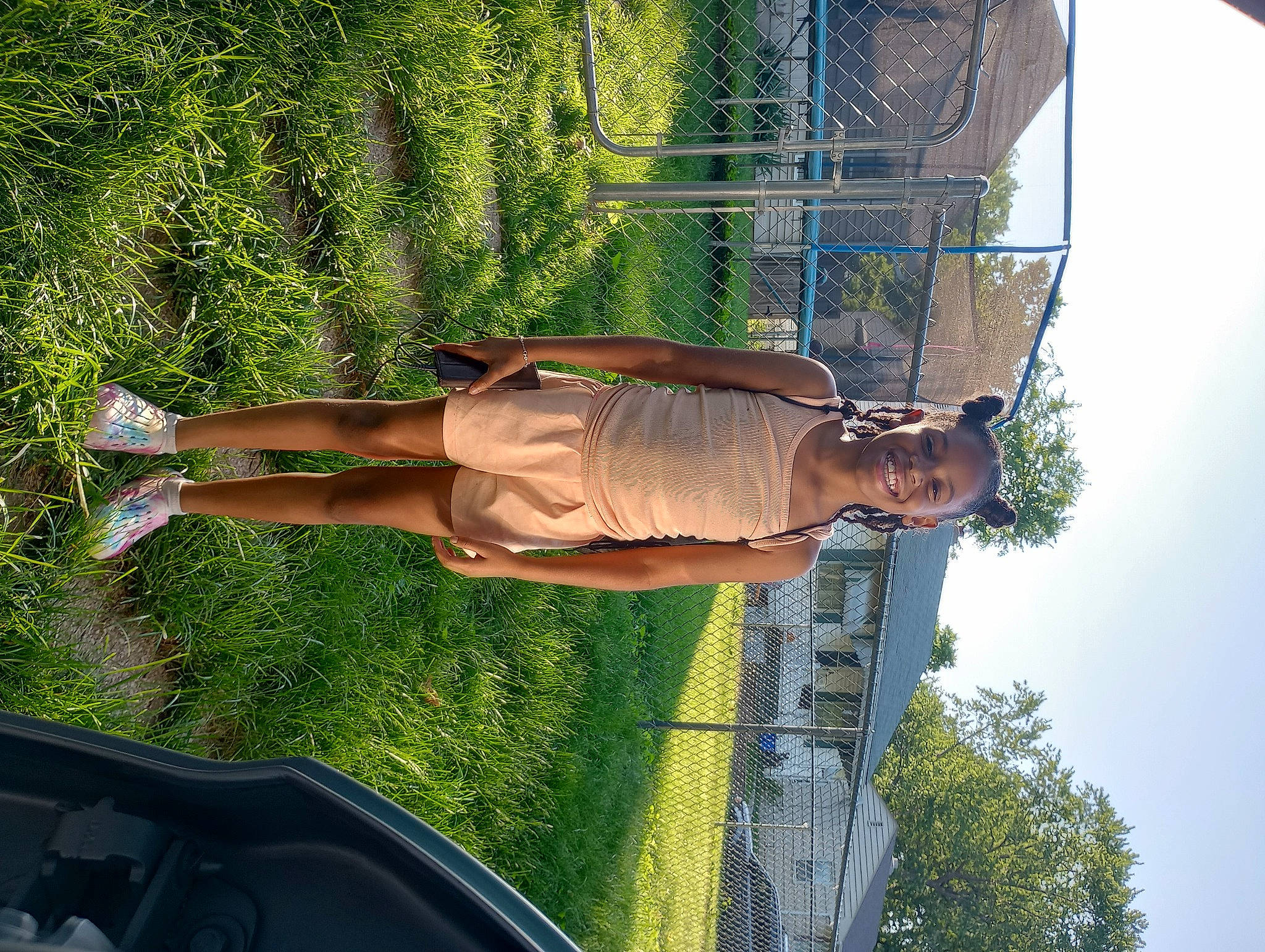 Liyah joined the competition — help win amazing prizes! cloud, elbow, fun, grass, human_leg, joy, leisure, mesh, people_in_nature, person, plant, recreation, shorts, sky, thigh, tree