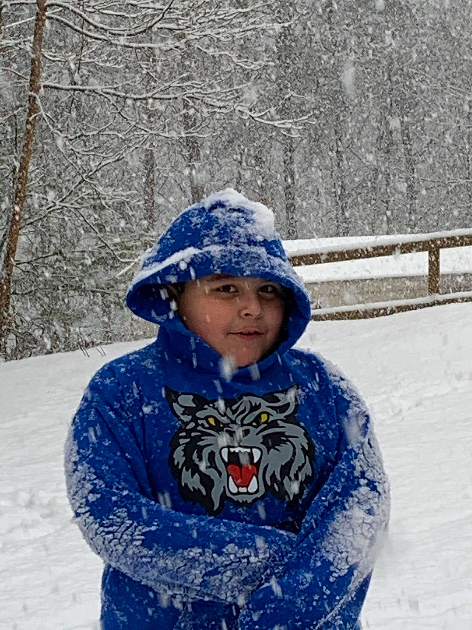 Elijah is registered to the contest to win money with this photo: blue, blue_and_white_porcelain, bonnet, cap, child, cobalt_blue, electric_blue, freezing, headgear, headwear, knit_cap, outerwear, person, playing_in_the_snow, snow, winter