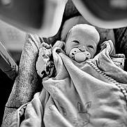 Hugo participe au concours pour gagner de l'argent avec cette photo : baby, blanket, pacifier, infant, black_and_white, soft_toy, cushion, child, sleepy, cute, portrait, cozy, indoors, newborn, wrapped, fabric, seat, comfort, face, peaceful