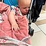 Kinsley is registered to the contest to win money with this photo: baby, sleeping, stroller, blanket, pink, hand, infant, child, clothing, person, floor, tile, indoor, resting, peaceful, cute, soft, wrapped, casual, toddler