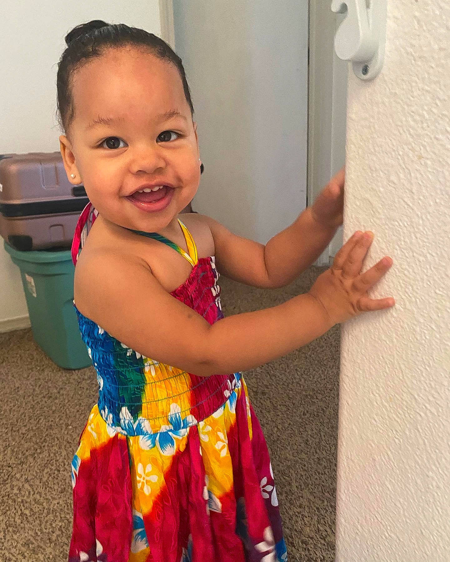 Alaiyah is registered to the contest to win money with this photo: arm, baby_toddler_clothing, child, elbow, event, facial_expression, fun, gesture, hairstyle, happy, joy, leisure, magenta, person, pink, play, room, shoulder, smile, standing
