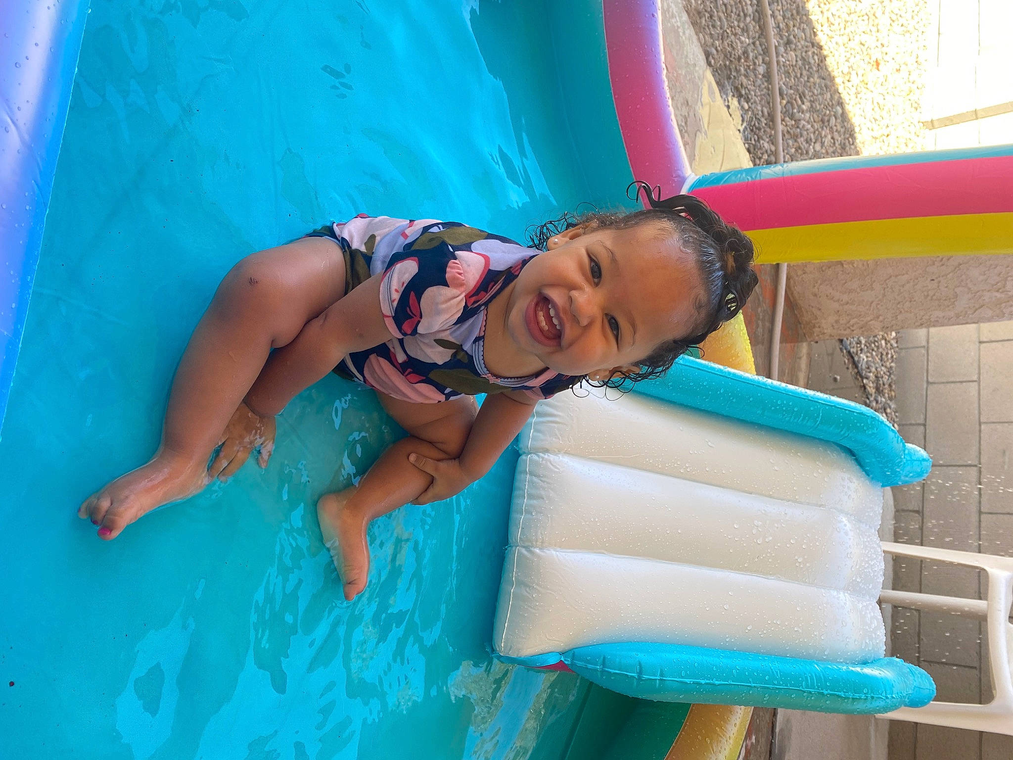 Alaiyah joined the competition — help win amazing prizes! aqua, azure, bathing, blue, child, electric_blue, fun, games, happy, inflatable, leisure, nonbuilding_structure, person, photograph, play, recreation, smile, swimming_pool, thigh, toddler