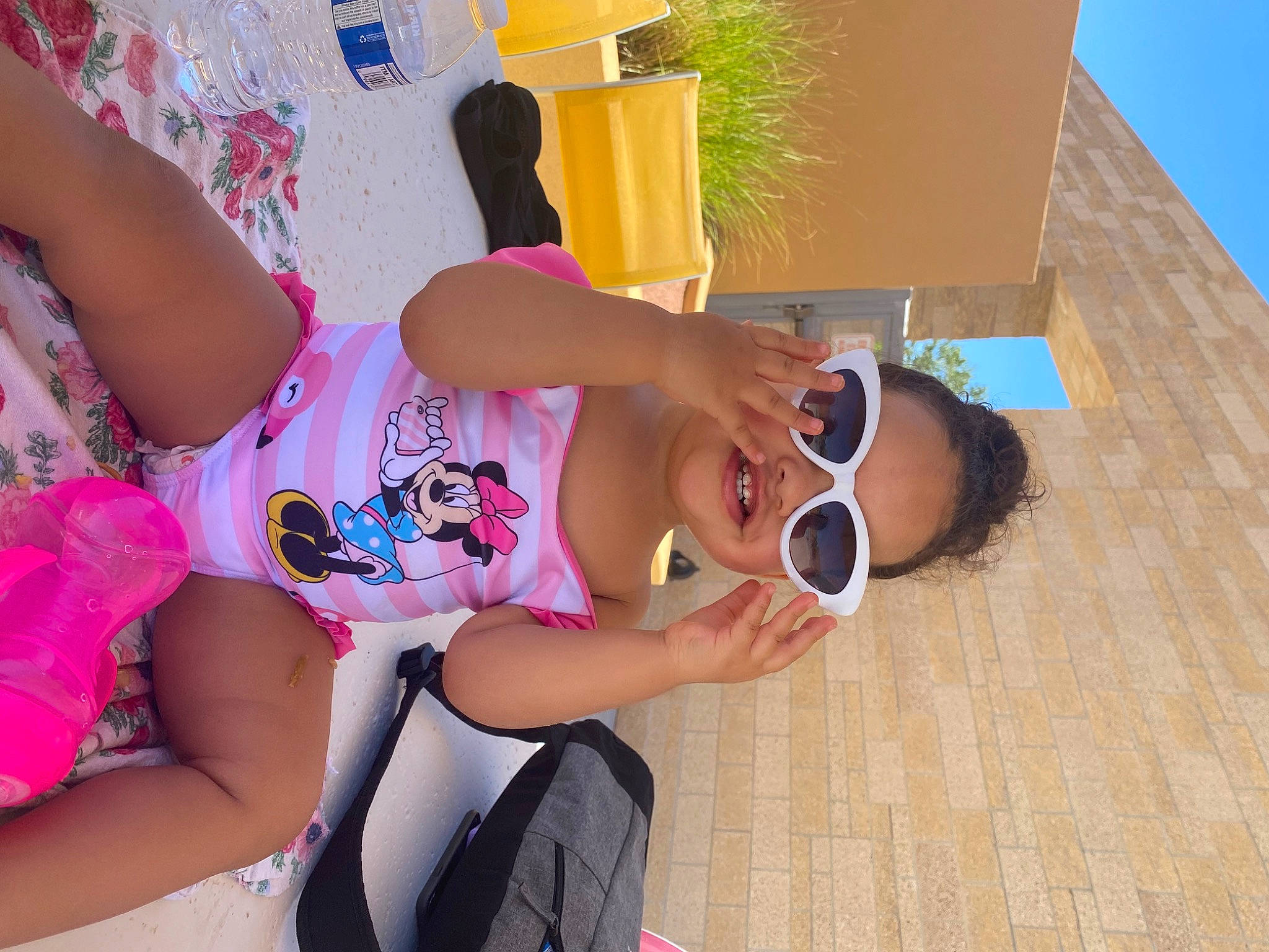 Alaiyah is registered to the contest to win money with this photo: child, event, eyewear, finger, fun, goggles, happy, human_leg, knee, leg, leisure, person, pink, shorts, sky, sunglasses, t_shirt, thigh, travel, vacation