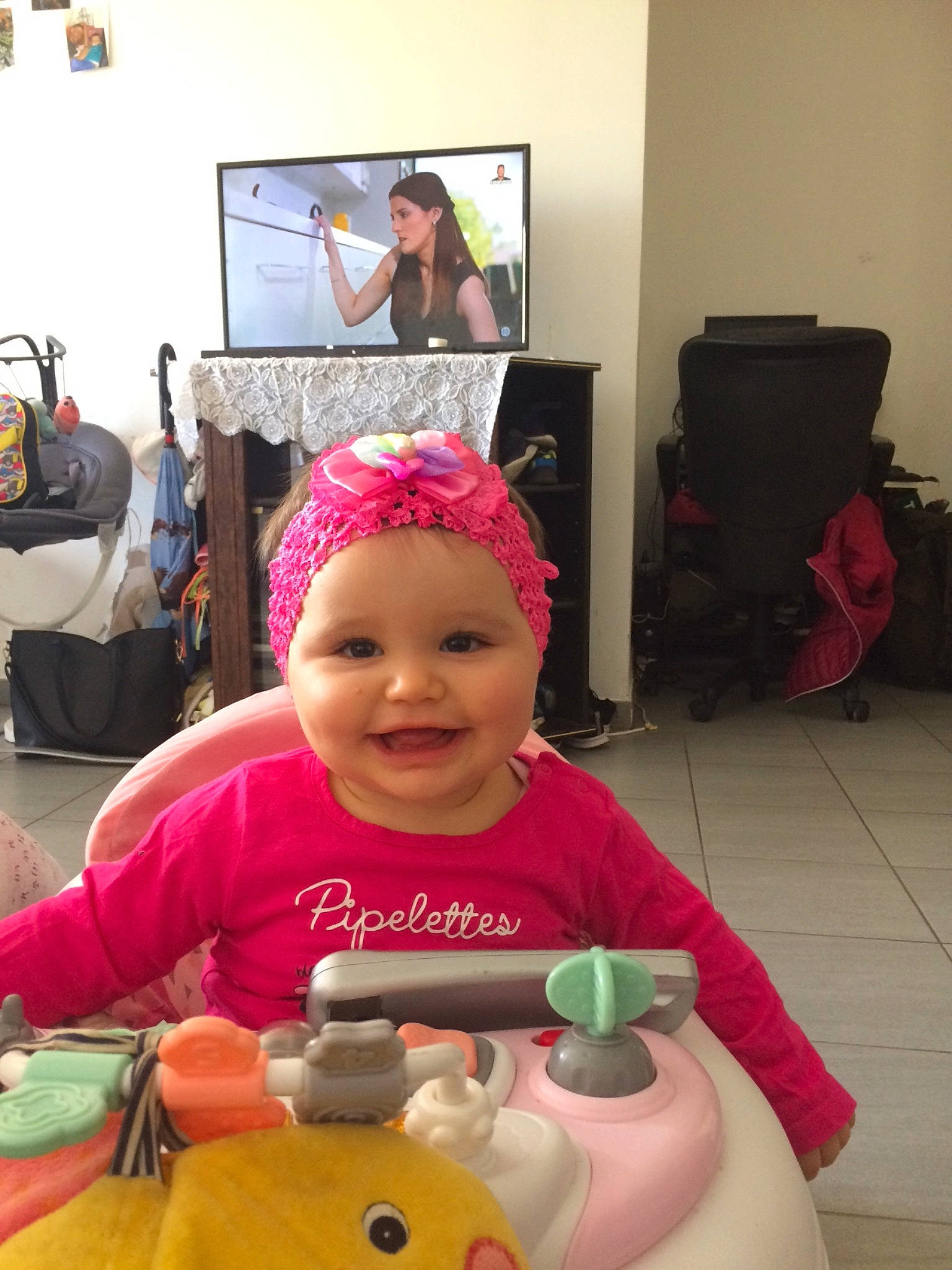 Nathea participe au concours pour gagner de l'argent avec cette photo : baby, bag, child, facial_expression, flooring, fun, happy, head, headwear, joy, leisure, luggage_and_bags, magenta, person, pink, play, product, room, smile, television