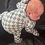 Noah is registered to the contest to win money with this photo: baby, infant, onesie, checkered_pattern, sleeping, face_down, pillow, blanket, indoor, soft_lighting, head, skin, newborn, clothing, resting, peaceful, cute, young_child, fabric, comfort