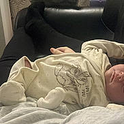 Noah joined the competition — help win amazing prizes! baby, sleeping, onesie, person, indoor, black_clothing, blanket, hand, couch, soft_lighting, cozy, rest, infant, relaxing, home, comfort, portrait, child, face, peaceful