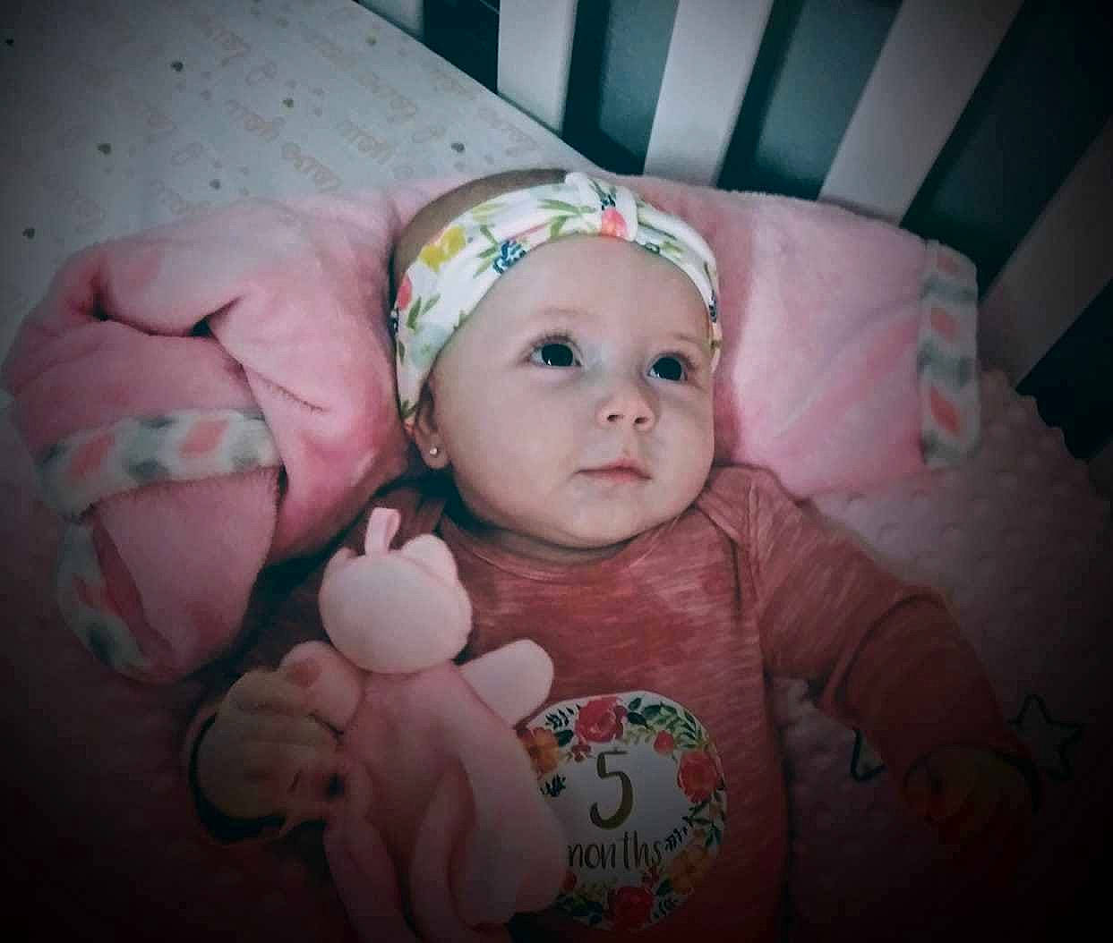 Journie is registered to the contest to win money with this photo: bedtime, cheek, child, eye, face, finger, girl, hair_accessory, head, infant, lip, mouth, nose, person, pink, product, skin, smile, toddler