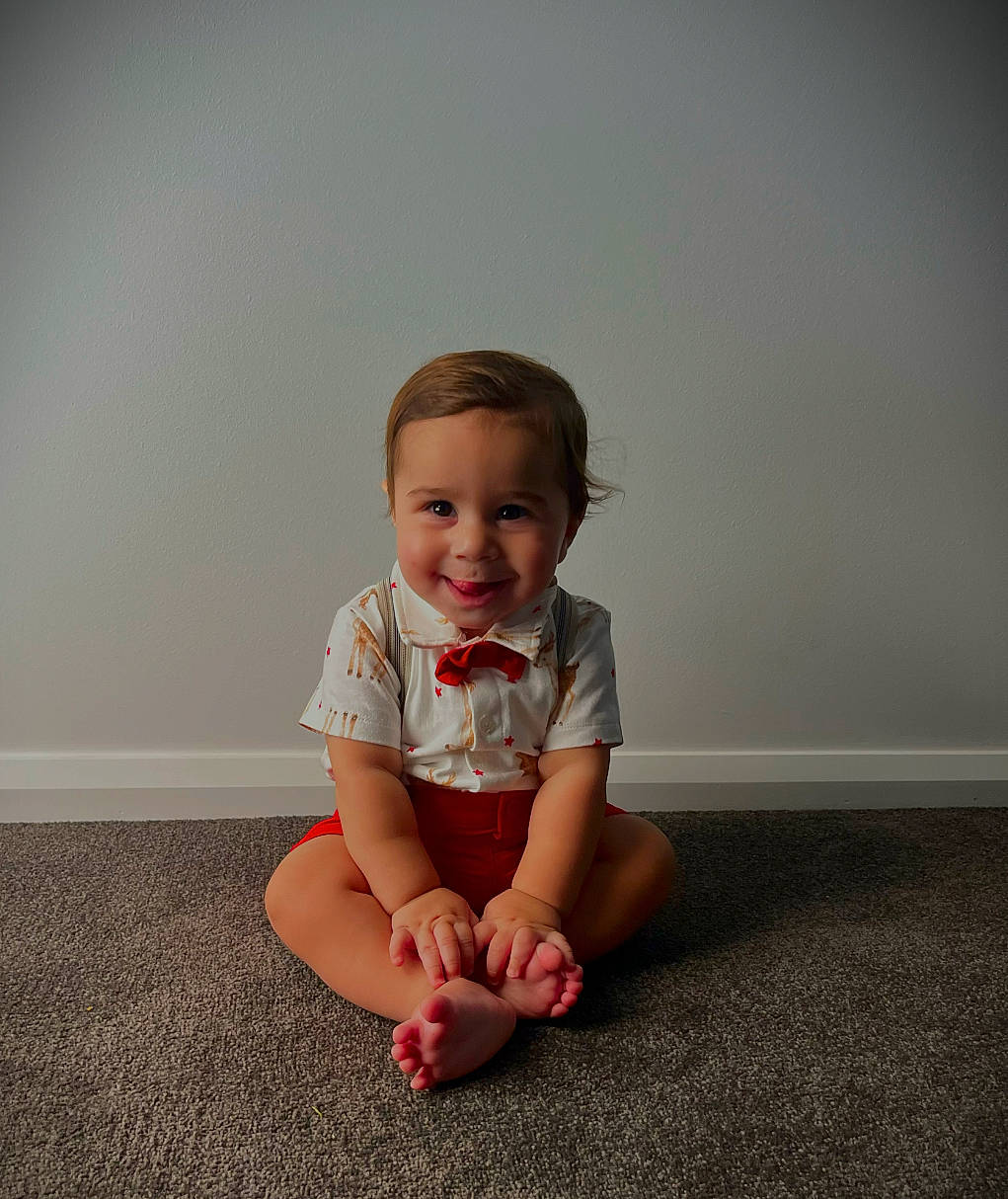 Jeziah joined the competition — help win amazing prizes! baby, baby_toddler_clothing, barefoot, carmine, child, flash_photography, floor, flooring, foot, fun, happy, human_leg, joint, joy, knee, person, sitting, skin, sleeve, smile