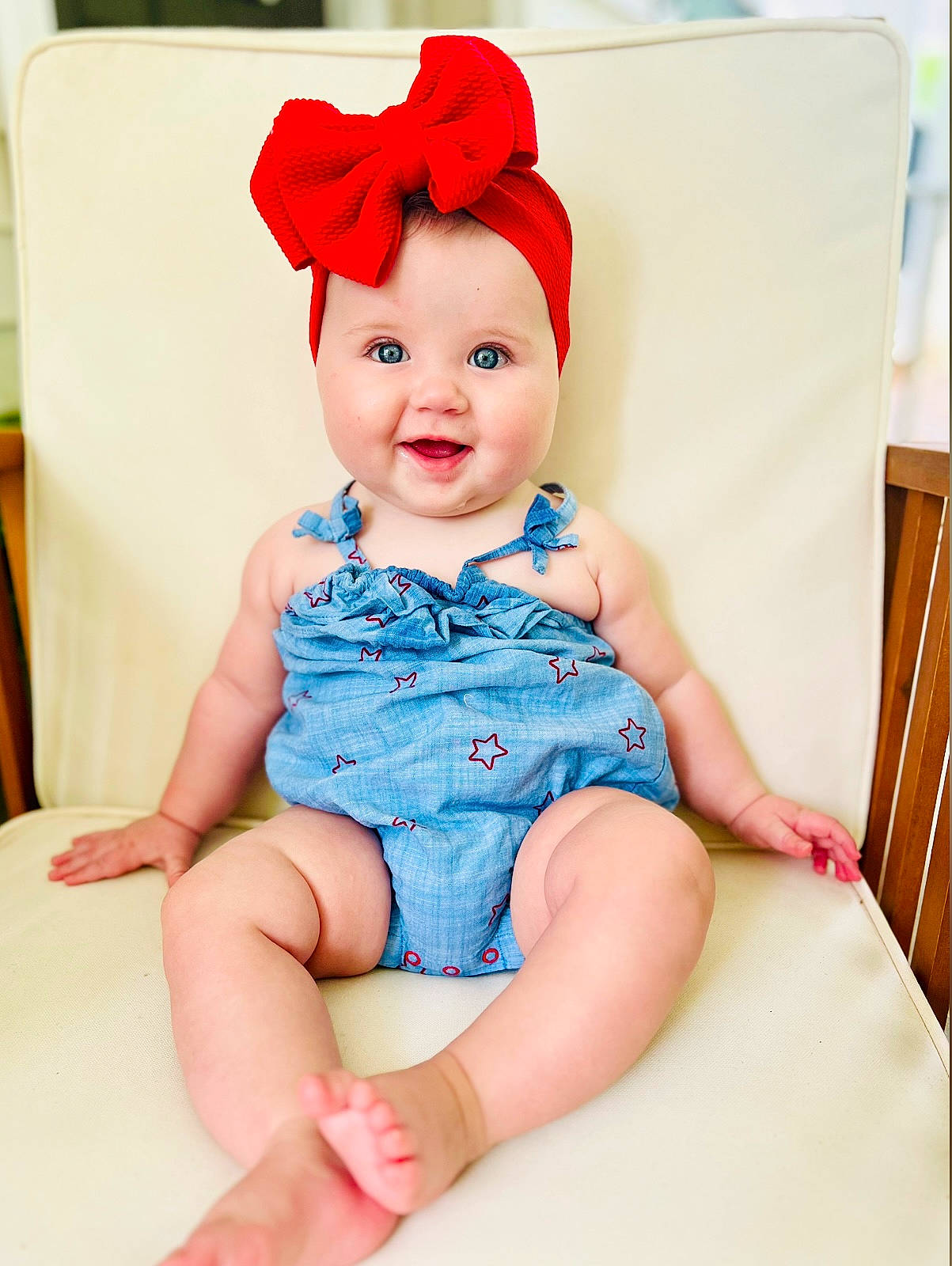 Navy is registered to the contest to win money with this photo: baby, baby_toddler_clothing, cap, child, costume_hat, dress, electric_blue, eye, foot, happy, hat, headgear, headwear, human_leg, joy, pattern, person, sitting, skin, sleeve