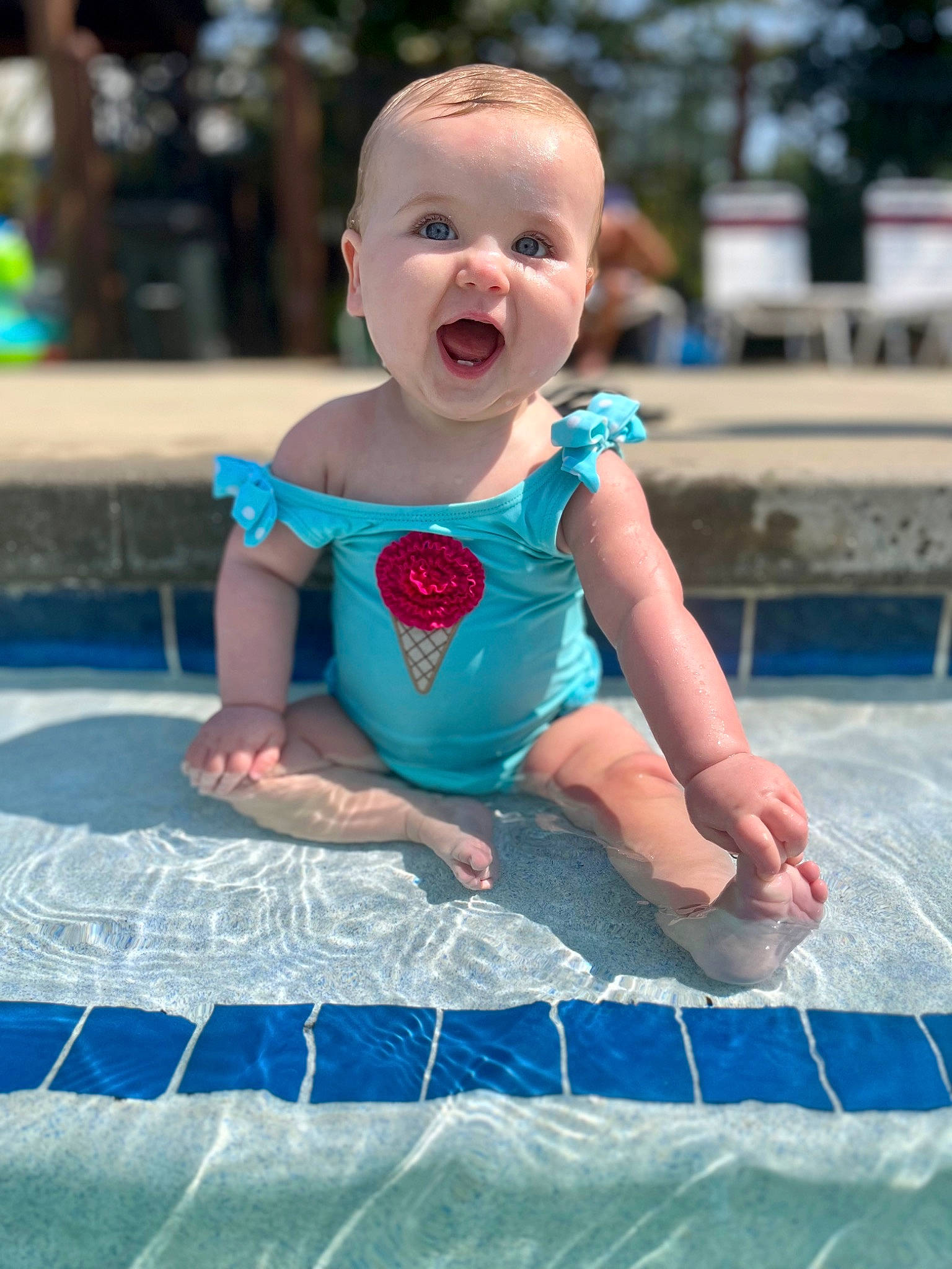 Navy is registered to the contest to win money with this photo: aqua, azure, baby, baby_toddler_clothing, beauty, child, event, fun, grass, happy, leisure, people, person, play, recreation, sitting, smile, summer, toddler, vacation