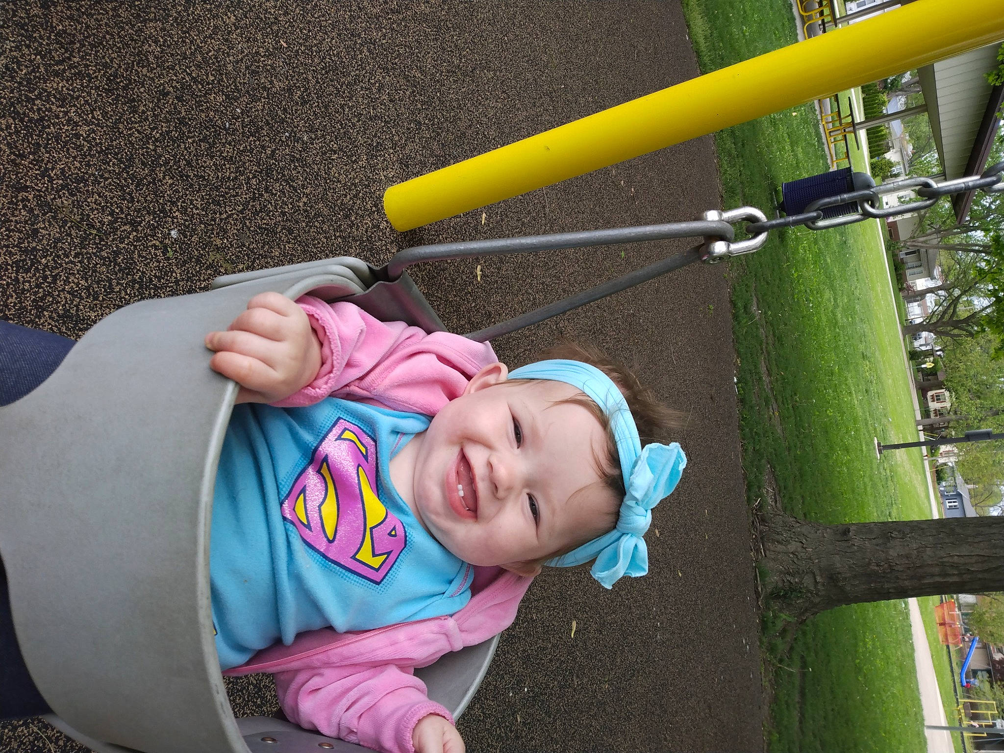 Fraya is registered to the contest to win money with this photo: baby, baby_carriage, baby_products, baby_toddler_clothing, city, comfort, eye, fun, grass, headwear, joy, lawn, leisure, person, photograph, plant, product, recreation, smile, swing