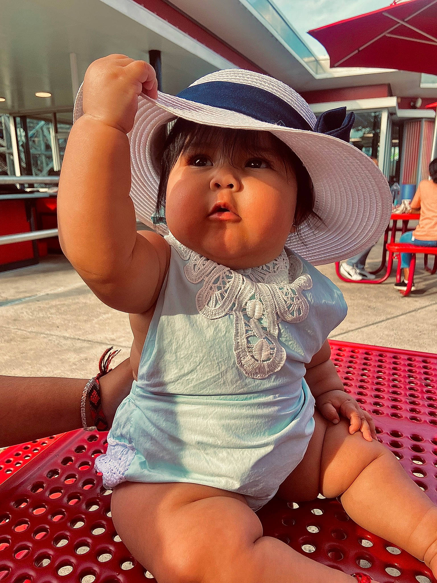Yaretzi is registered to the contest to win money with this photo: baby, baby_toddler_clothing, chair, cool, eyewear, facial_expression, fun, hairstyle, happy, hat, human_leg, leisure, mouth, person, pink, recreation, shorts, skin, sun_hat, thigh