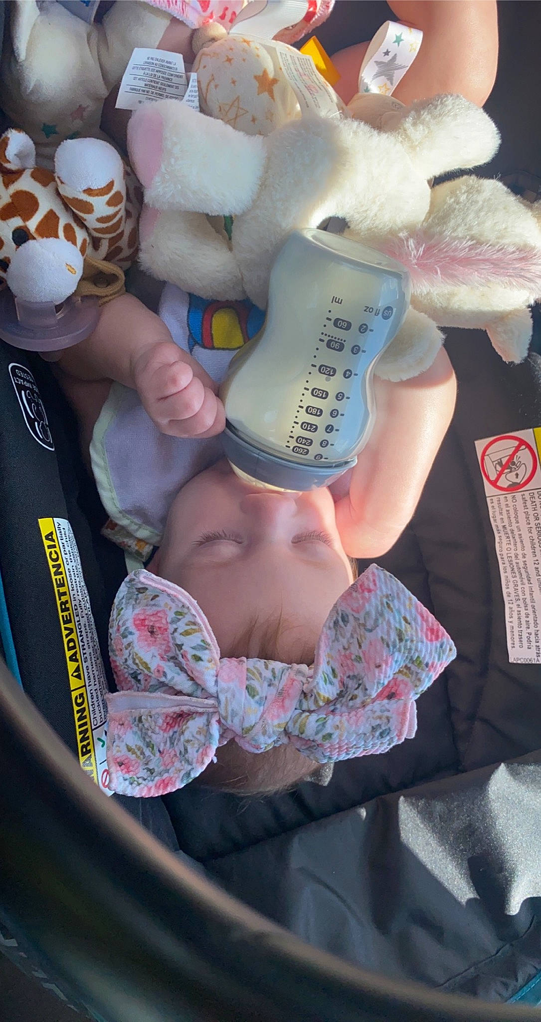 Kinsley is registered to the contest to win money with this photo: abdomen, baby, baby_products, chest, child, drinkware, flesh, health_care, human_leg, linens, nail, pattern, person, pink, plastic, plastic_bottle, service, toddler, toy, white