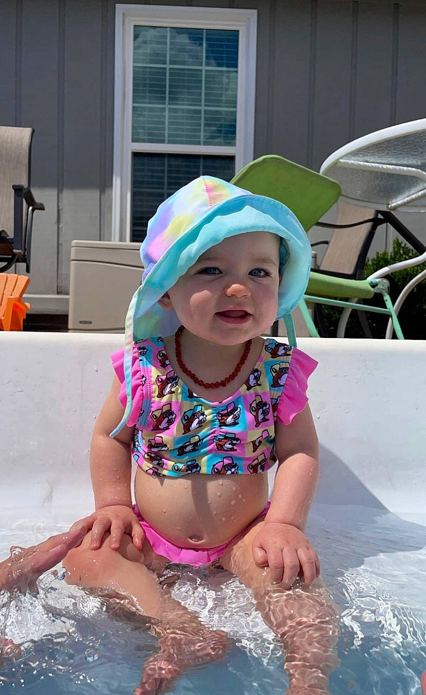 Anniston joined the competition — help win amazing prizes! bathing, brassiere, cap, child, event, fashion_accessory, fun, happy, headgear, headwear, leisure, person, personal_protective_equipment, pink, recreation, summer, swimwear, toddler, undergarment, underpants