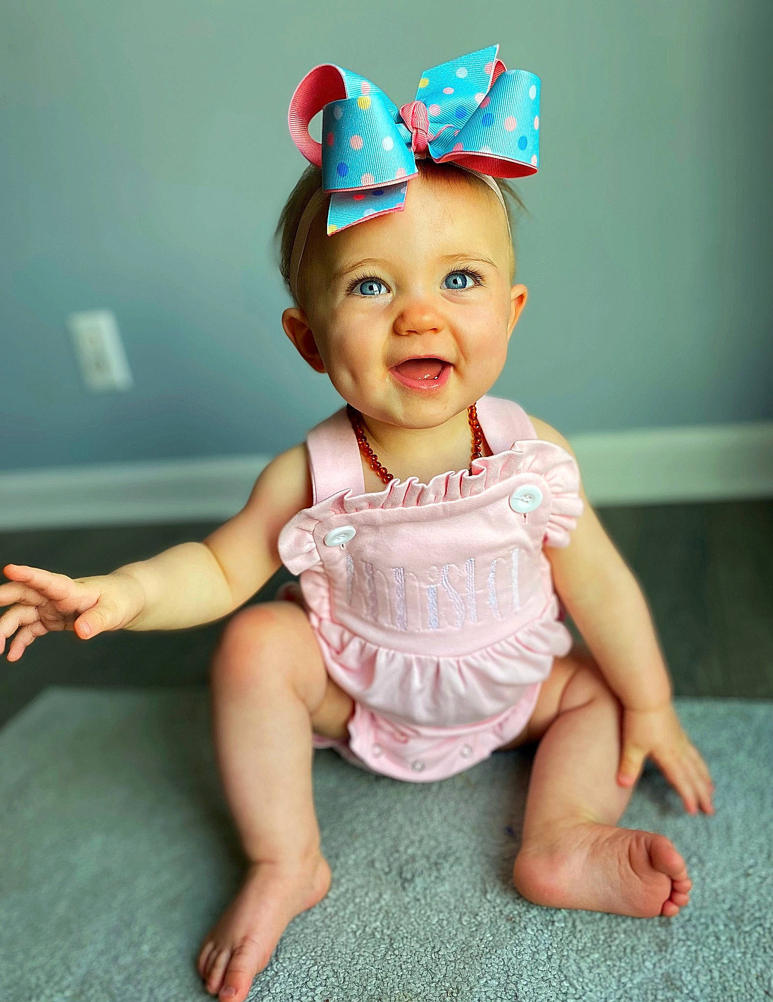 Anniston joined the competition — help win amazing prizes! baby, baby_toddler_clothing, cap, cheek, costume_hat, eye, face, fashion_accessory, finger, happy, head, headwear, iris, lip, neck, party_supply, person, pink, skin, sleeve