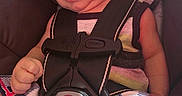 Xavier is registered to the contest to win money with this photo: baby, infant, child, smiling, portrait, car_seat, seatbelt, harness, safe_travel, vehicle_interior, plaid_clothing, colorful_clothing, sitting, close_up, face, baby_carrier, happy, indoors, date_stamp, photograph