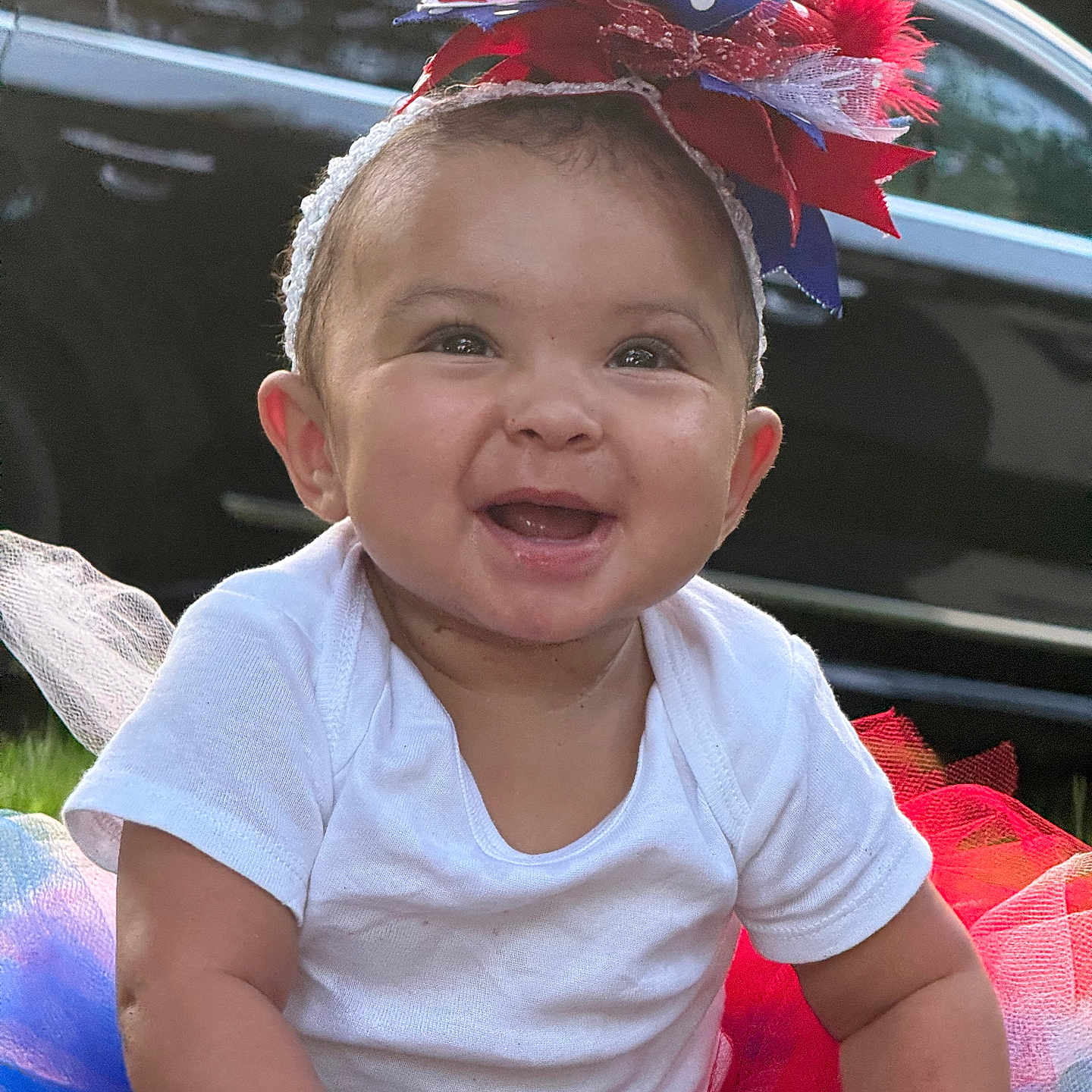 Nariah is registered to the contest to win money with this photo: accessories, alloywheel, baby, car, carwheel, clothing, dress, face, happy, hat, head, machine, person, photography, portrait, smile, summer, t_shirt, transportation, vehicle