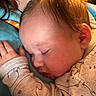 Parker is registered to the contest to win money with this photo: baby, sleeping, closeup, face, person, hand, clothing, soft_lighting, cozy, infant, skin, hair, ear, blanket, comfort, peaceful, resting, child, warm, toddler