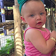 Kayliana joined the competition — help win amazing prizes! toddler, child, baby, headband, green_bow, pink_tank_top, colorful_skirt, tattoo, arm, wooden_post, wire_fence, outdoor, daylight, person, cute, blue_eyes, portrait, holding, clothing, nature